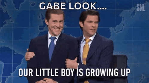two men in suits and ties standing next to each other with a caption that says gabe look our little boy is growing up