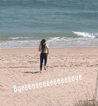 a person running on a beach with byeeeeeeeeeeeeeeeeeeeeeee