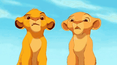 two lion cubs from the lion king are looking up at the sky