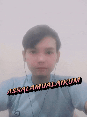 a young man wearing ear buds and a shirt that says assalamualaikum