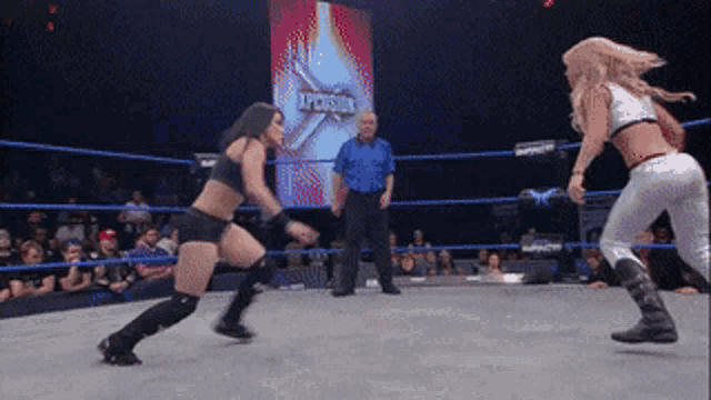 two women are wrestling in a ring with the word intercontinental on the screen behind them