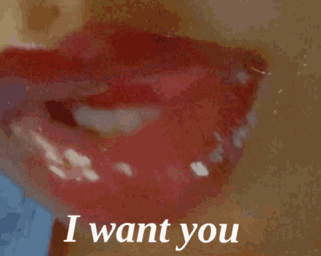 a close up of a woman 's lips with the words " i want you " written below it