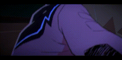 a man is looking at a computer screen with the letter s on his chest