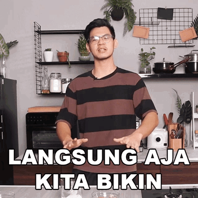 a man standing in a kitchen with the words langsung aja kita bikin on the bottom