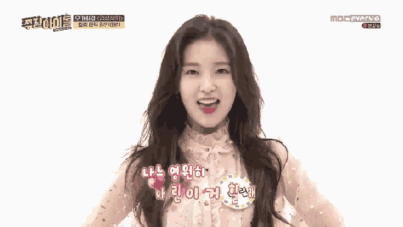 a girl with korean writing on her face is on a tv show