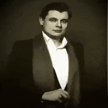 a black and white photo of a man in a tuxedo with russian writing on it