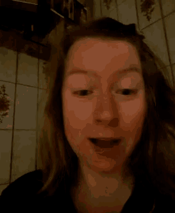 a woman with a surprised look on her face