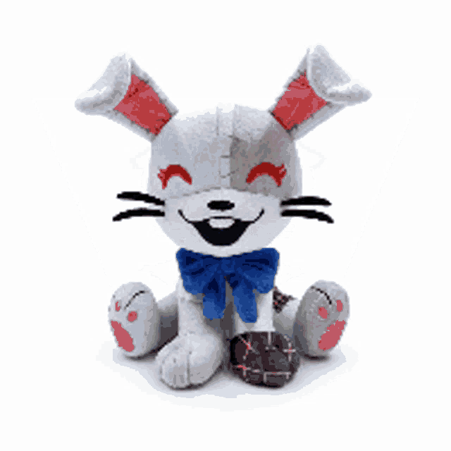 a stuffed animal with a blue bow tie and a smiley face