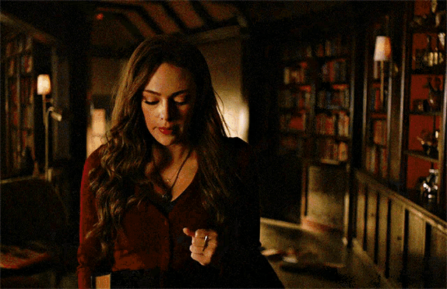 a painting of a woman in a dark room with smoke coming out of her hand