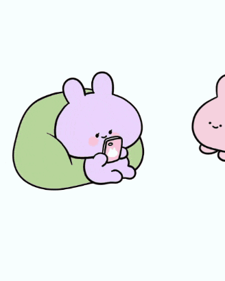 a pink bunny and a purple bunny are sitting in front of a computer and the bunny is saying you love me .