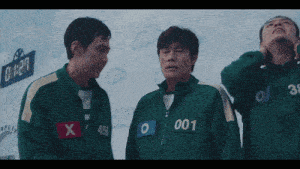a group of men wearing green jackets with the number 001 on the front