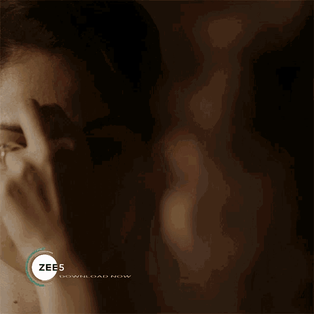 an advertisement for zee5 shows a woman and a man