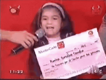a little girl holding a cheque that says montecarlo