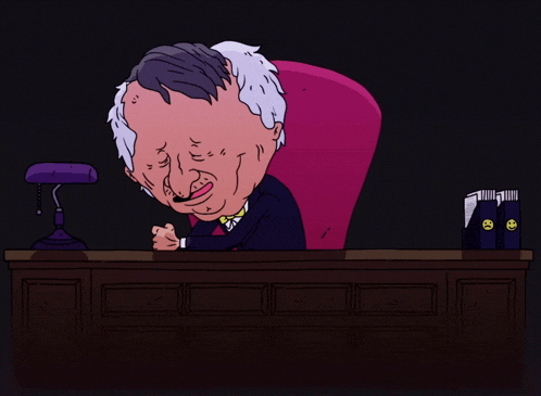 a cartoon of a man sitting at a desk with a lamp behind him