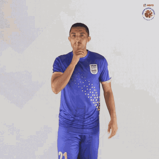 a man wearing a blue shirt that says hero soccer league