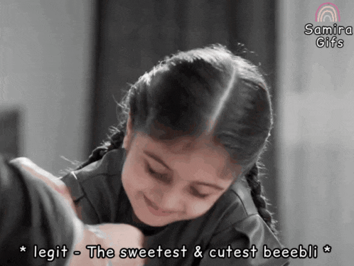 a picture of a little girl with the words " legit the sweetest & cutest beeebli "