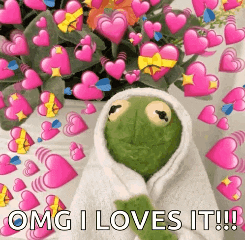 kermit the frog is wrapped in a white towel and surrounded by pink hearts and flowers .