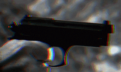 a blurry picture of a gun with a rainbow colored border