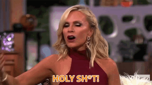 a blonde woman in a red dress is saying holy shit