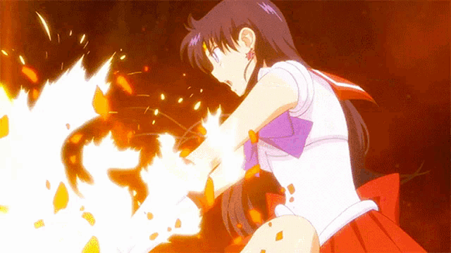 a girl in a red and white outfit is holding a fireball