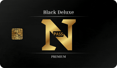 a black deluxe pass with a gold n on it