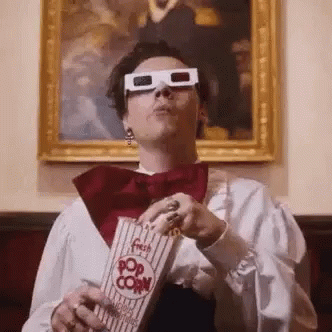 Watching Movie Eating Popcorn GIF - Watching Movie Eating Popcorn Hungry All The Time GIFs