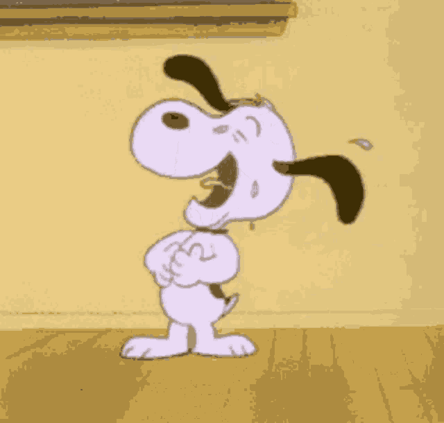 a cartoon of snoopy laughing and crying with his mouth open