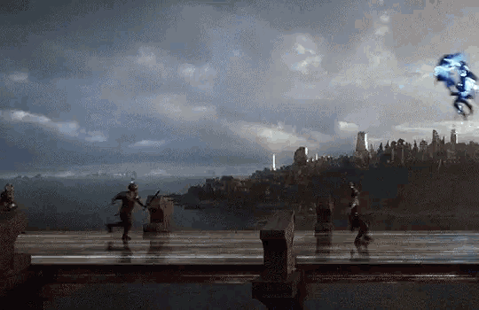 a group of people standing on a bridge overlooking a body of water .