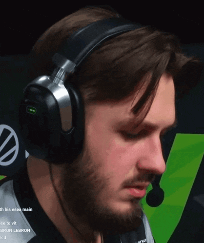 a man with a beard wearing headphones and a microphone with the word lebron on it