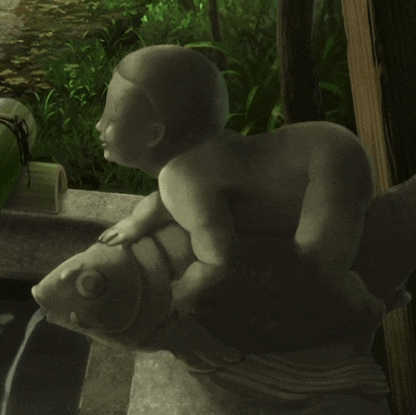 a statue of a baby sitting on top of a fish with water coming out of it