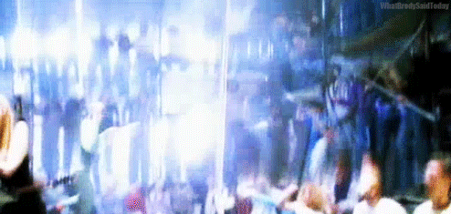 a crowd of people are gathered in a stadium watching a concert .