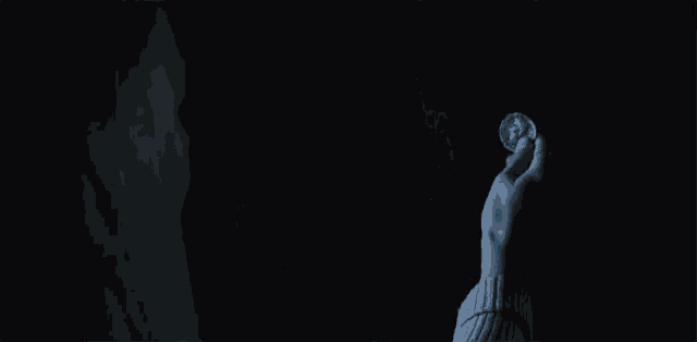 a blurry picture of a woman 's face in a dark room