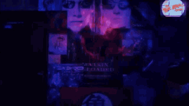 a matrix loaded poster is displayed on a dark wall