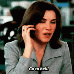a woman talking on a cell phone and saying go to hell