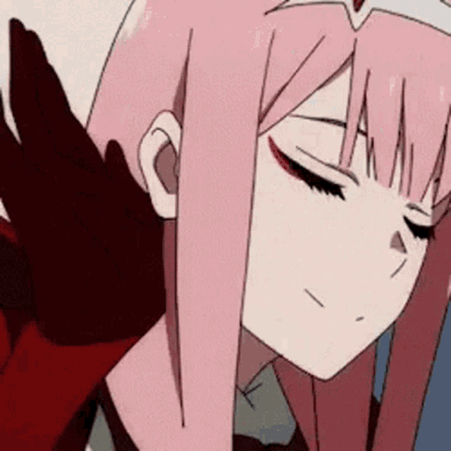 a close up of a pink haired anime girl with her eyes closed