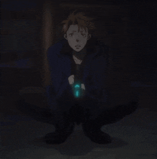 a man in a blue jacket is kneeling down with his eyes closed and holding a glowing object