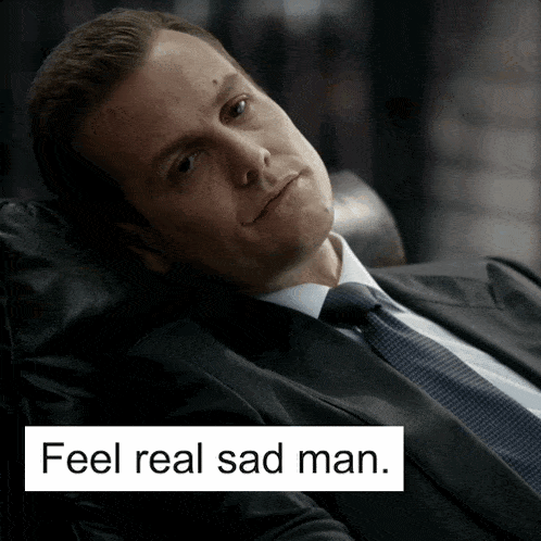 a man in a suit and tie is laying on a couch with the words feel real sad man below him