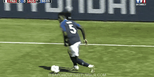 a soccer player with the number 5 on the back of his jersey