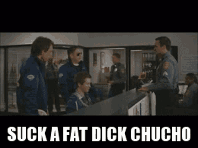 a group of police officers standing around a counter with the words " suck a fat dick chucho "