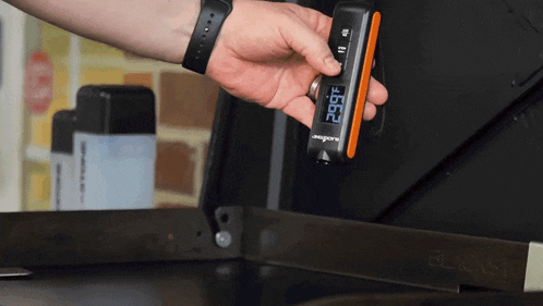 a person is holding a thermometer that reads 29.99 degrees fahrenheit