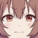 a close up of a girl 's face with a smirk on it .