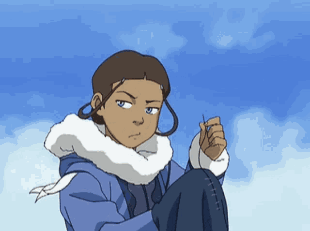 a girl in a blue jacket with a white fur collar looks at the camera