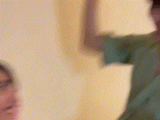 a close up of a person 's face with a yellow background