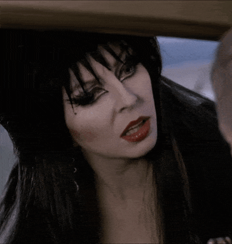 a close up of a woman 's face with red lips