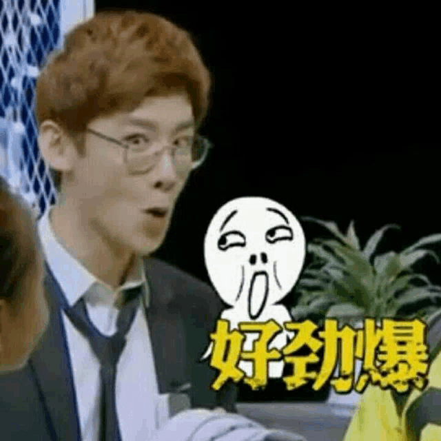 a man in a suit and tie is making a funny face while talking to a woman .