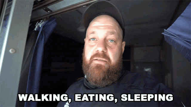 a man with a beard says walking eating sleeping