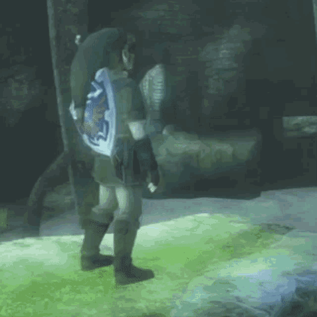 a man in a video game is standing in a cave .
