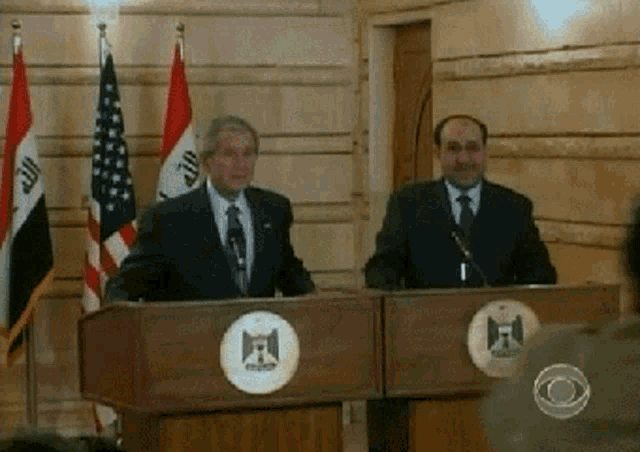 a man stands at a podium with a logo that says ' egypt '