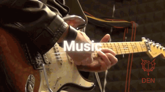 a person playing a guitar with the word music written above them