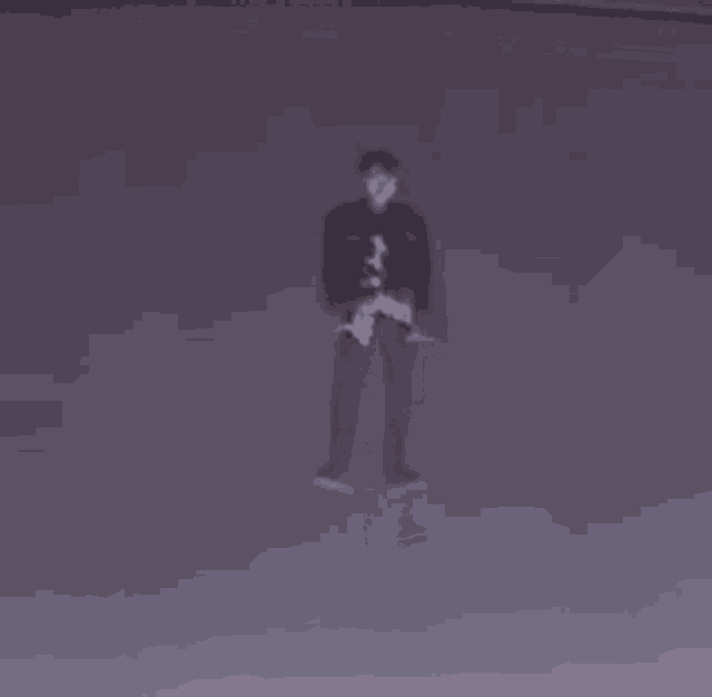 a man is flying through the air while holding a skateboard .